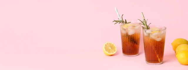 A glass of iced tea with lemon and mint