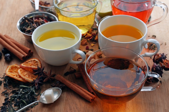 A few different kinds of tea in different tea cups